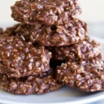 Pile of chocolate no-bake cookies on a white plate